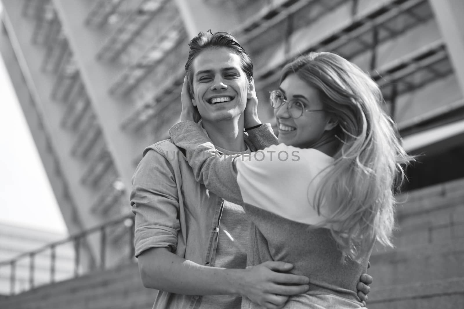 Beautiful couple in love dating outdoors and smiling.