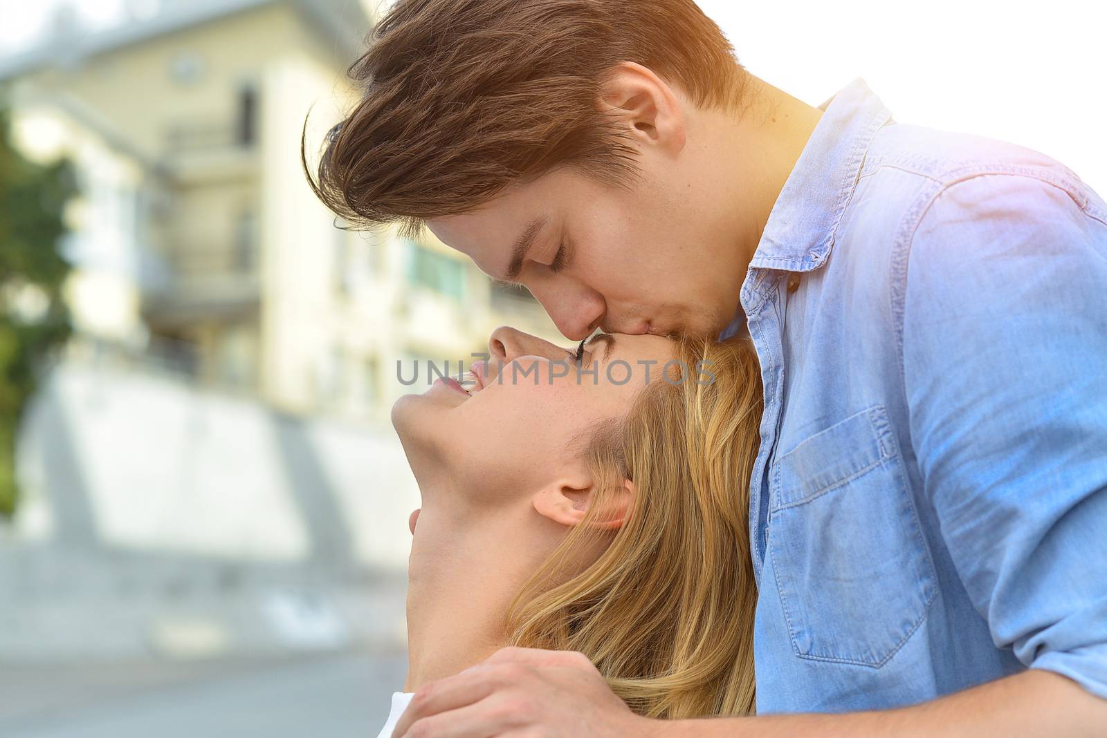 Beautiful couple in love dating outdoors and smiling.