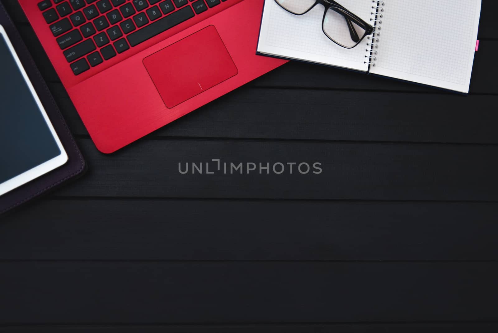 Home work concept, Tablet Pc, notepad and Laptop on wooden background, planning personal income. preparation to work. free copyspace