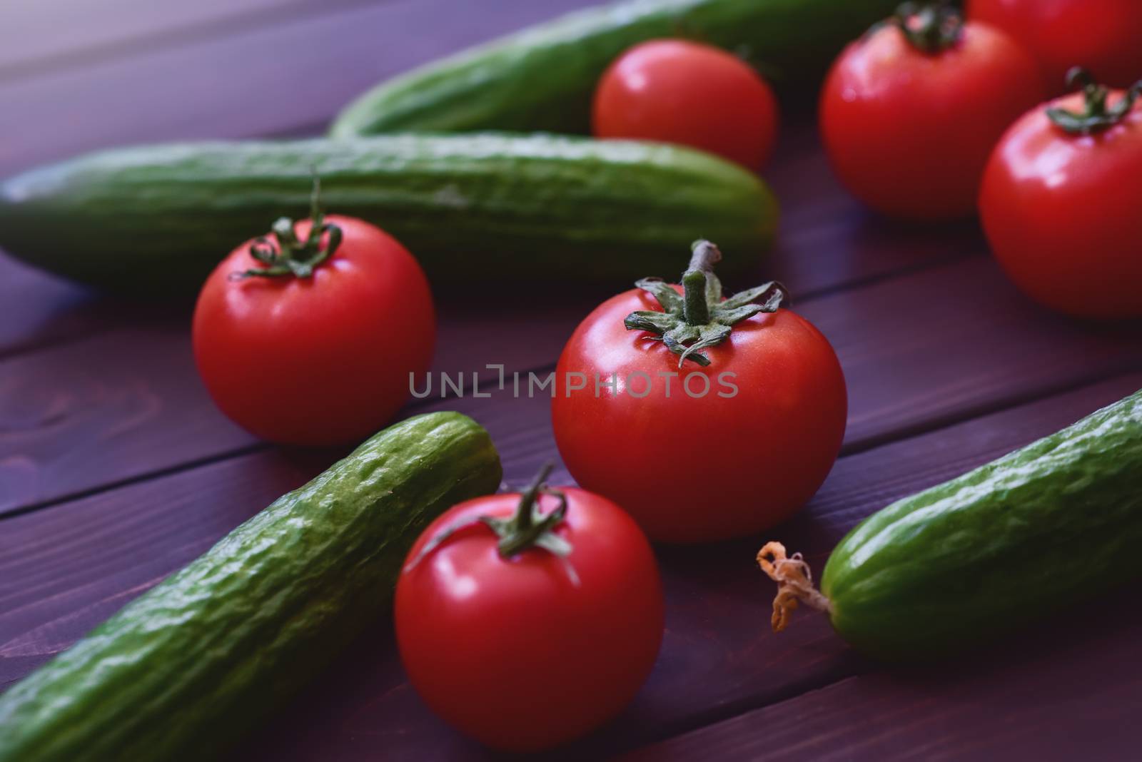 Nature Gifts. Benefits for the body. Fresh sliced vegetables lie on a wooden table. Tomatoes .cucumbers