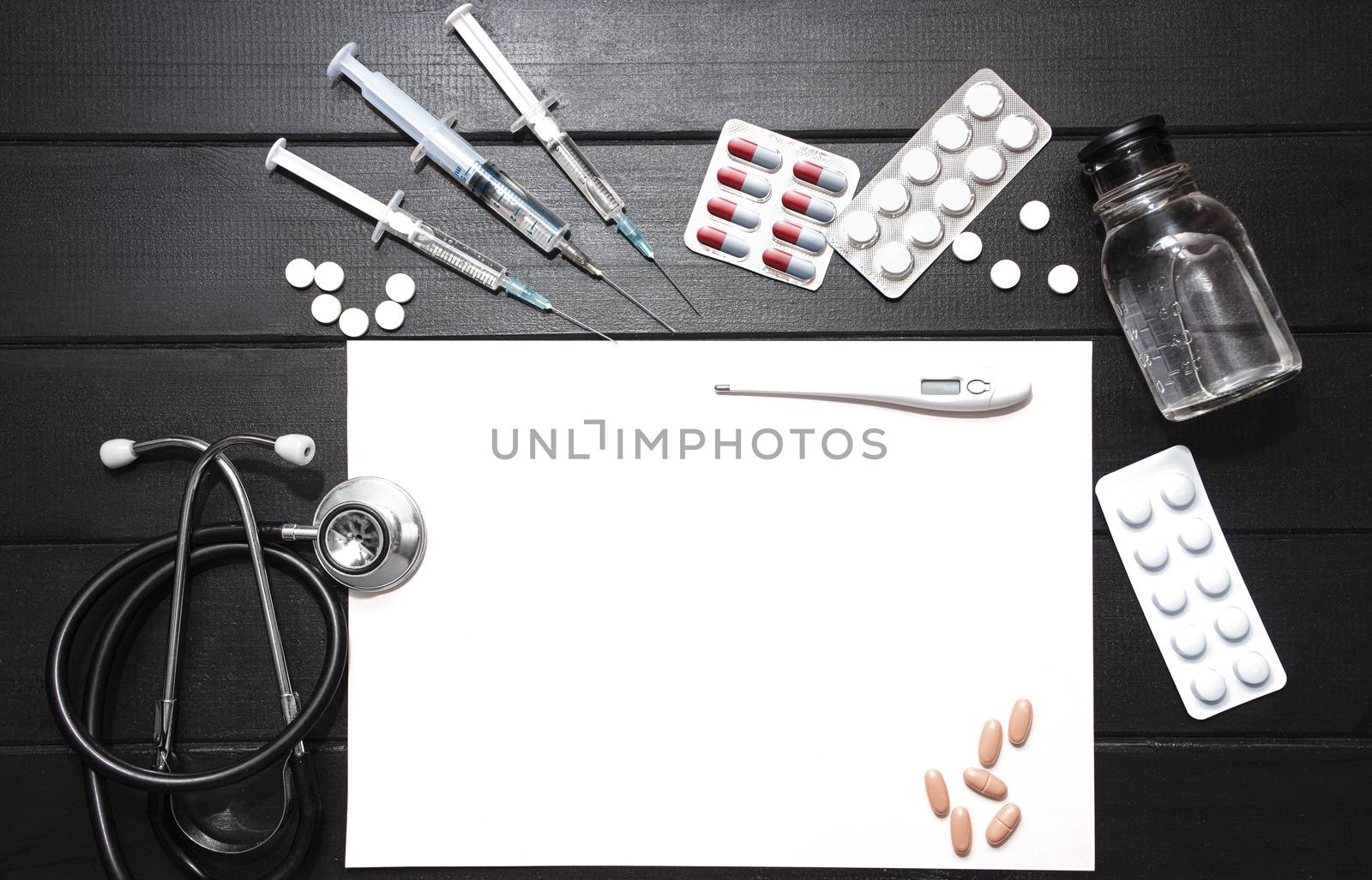 Medical Tools, Syringe and Colorful Drugs and Capsules Medicine Concept, Brown Wood Background, Front View, Close Up, Isolated