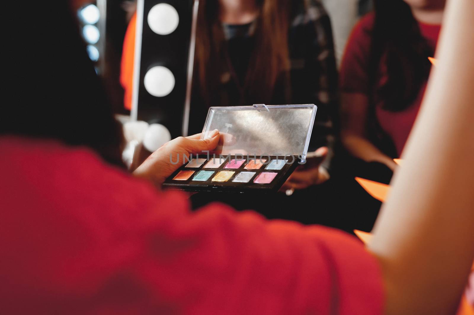 makeup. The process of applying makeup will begin. Colorful palette. Cosmetics for festive evening day makeup