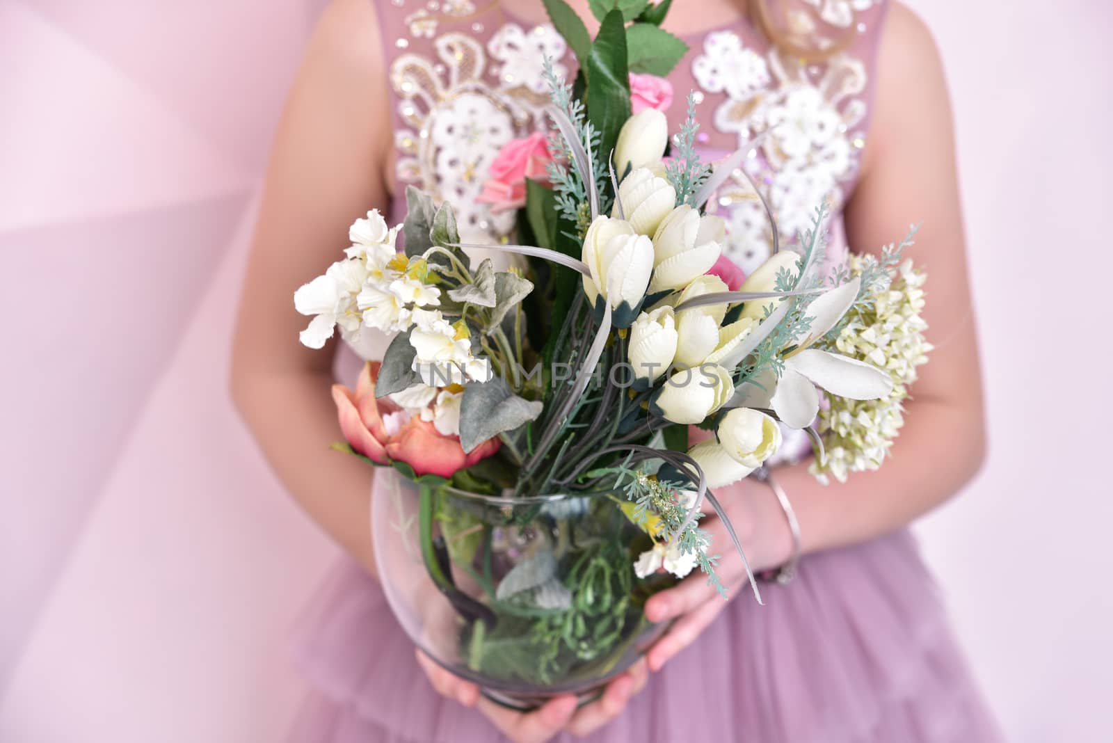 little girl with artificial flowers, close-up view