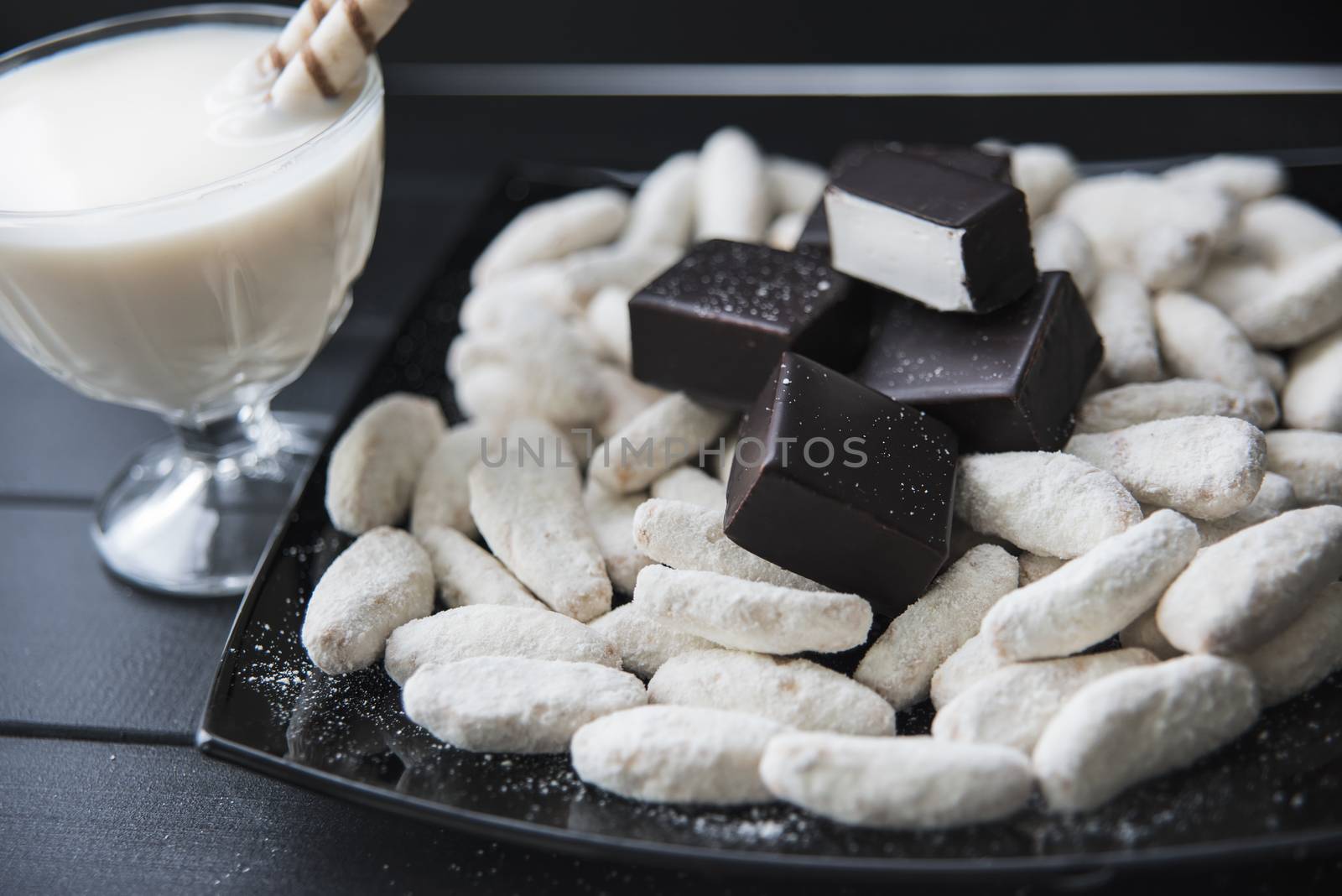 sweets, straws in the cream,cookies and candies on the table