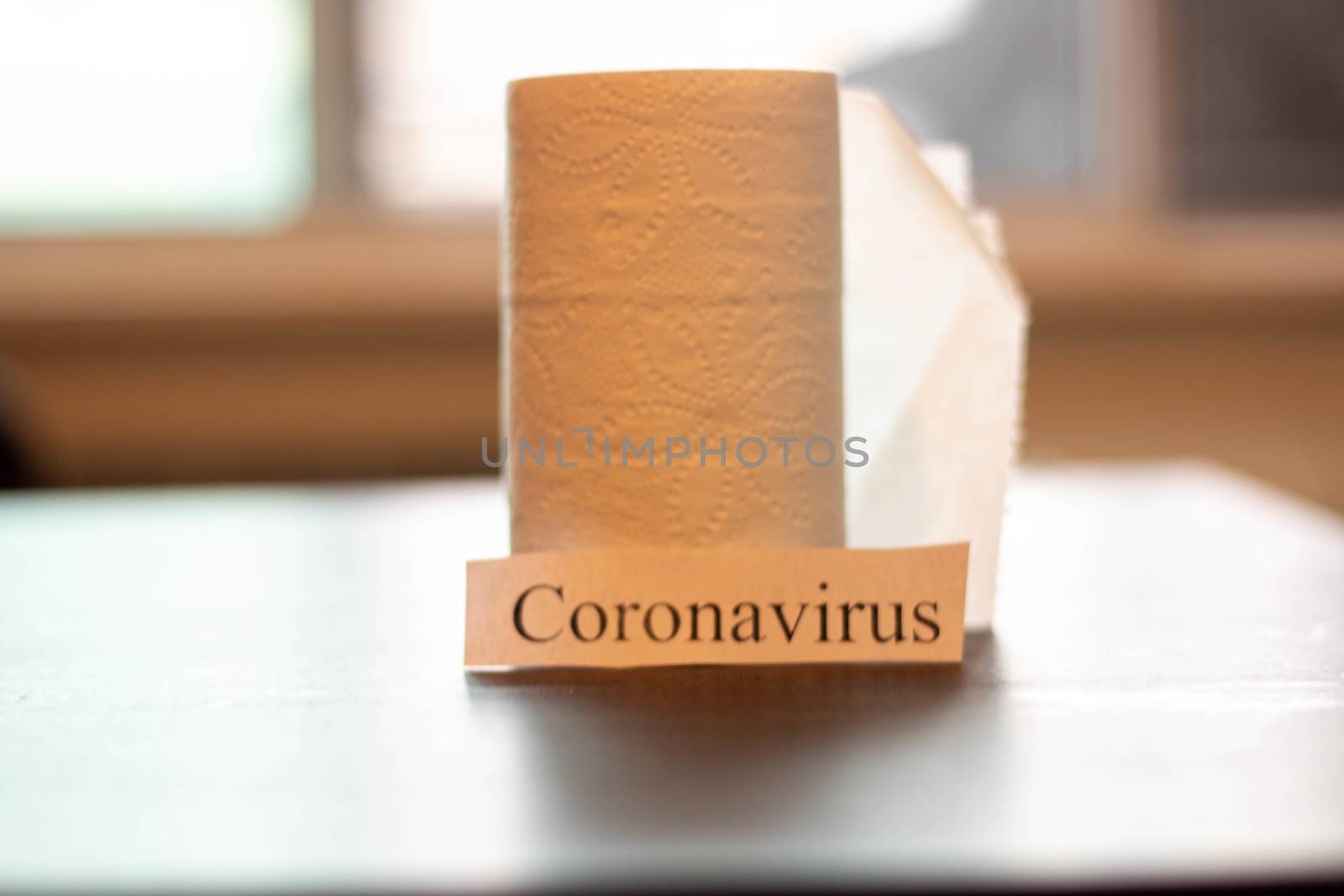 Coronavirus next to rolls of toilet paper. Theme of stocking up on supplies by mynewturtle1