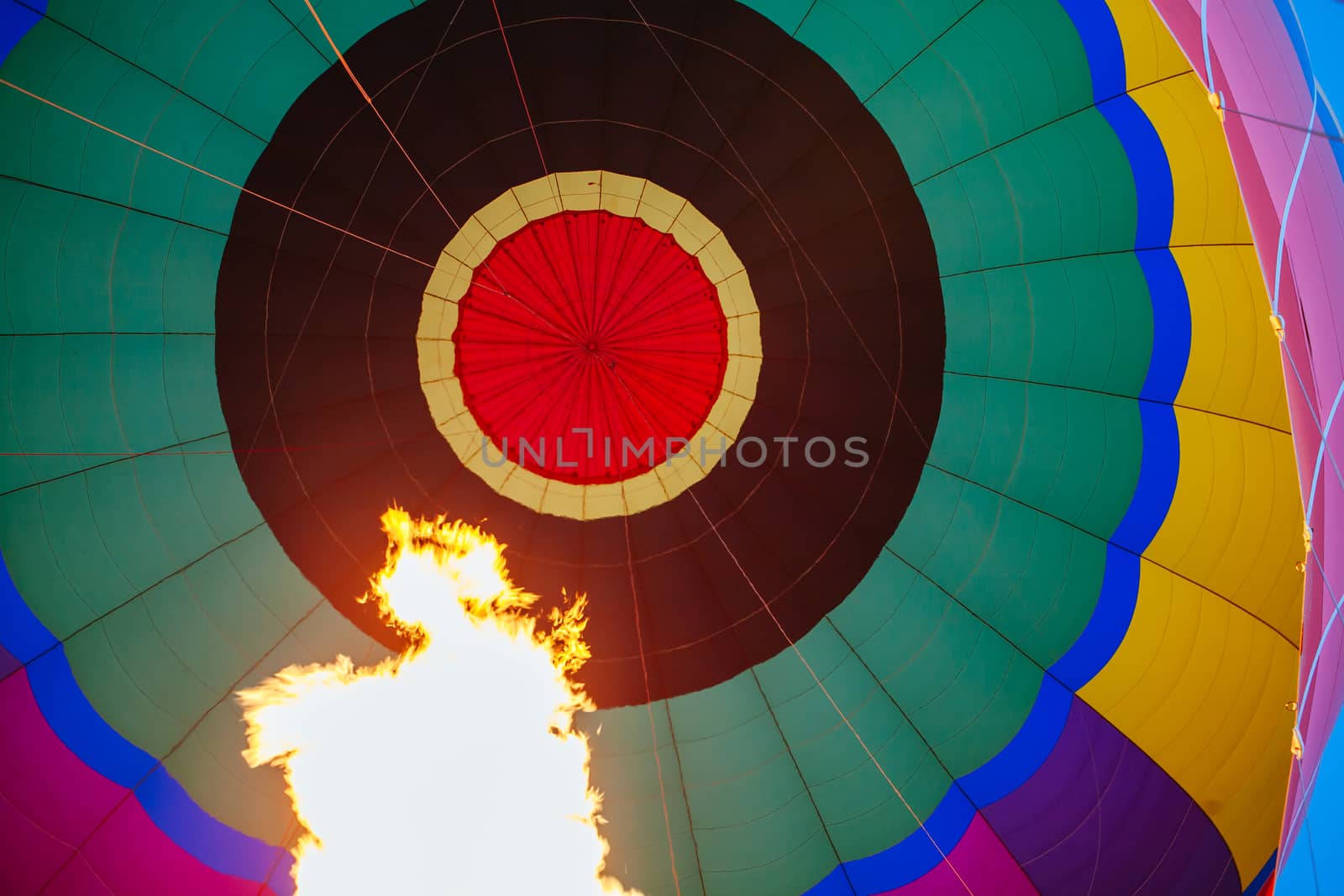 A blast of gas ignites, filling a hot air balloon with warm air on a cold winter's morning in Yarra Valley, Victoria, Australia
