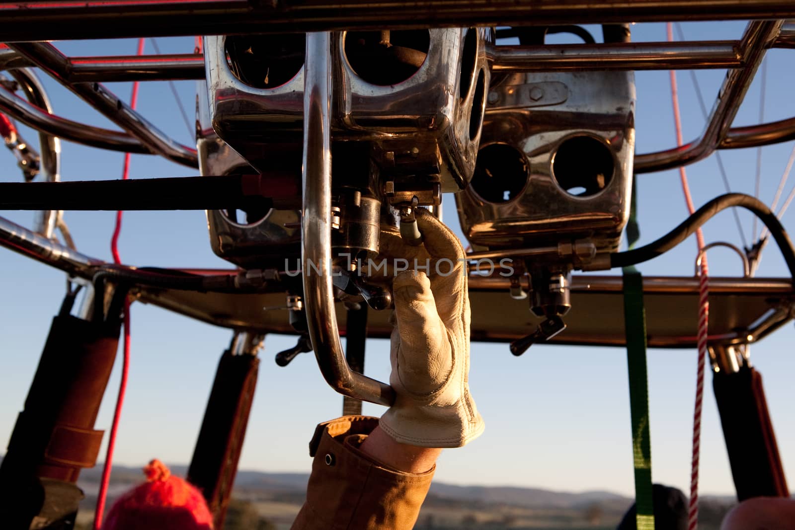 Healesville, Australia - July 24 2009: A man controls gas and flame, filling a hot air balloon with warm air on a cold winter's morning in Yarra Valley, Victoria, Australia