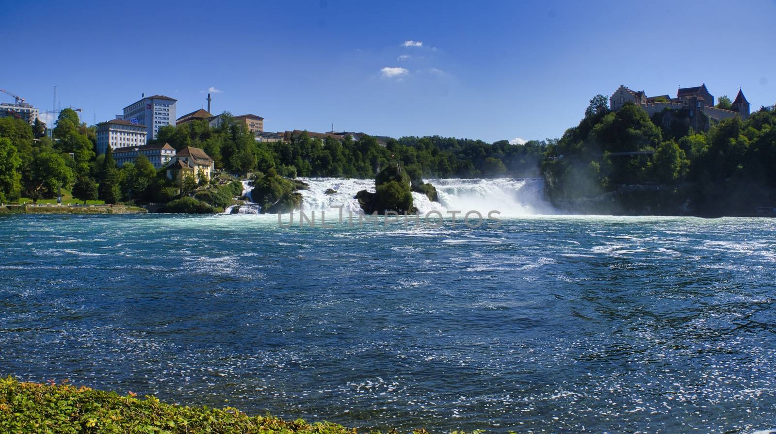 the famous rhine falls in the swiss near the city of Schaffhausen - sunny day and blue sky