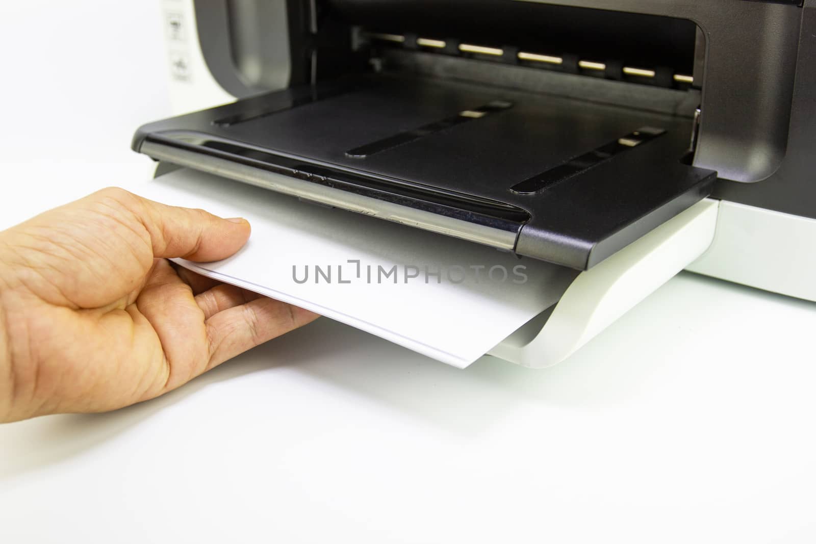 hand man lay down the paper from printer in the office, Business concept