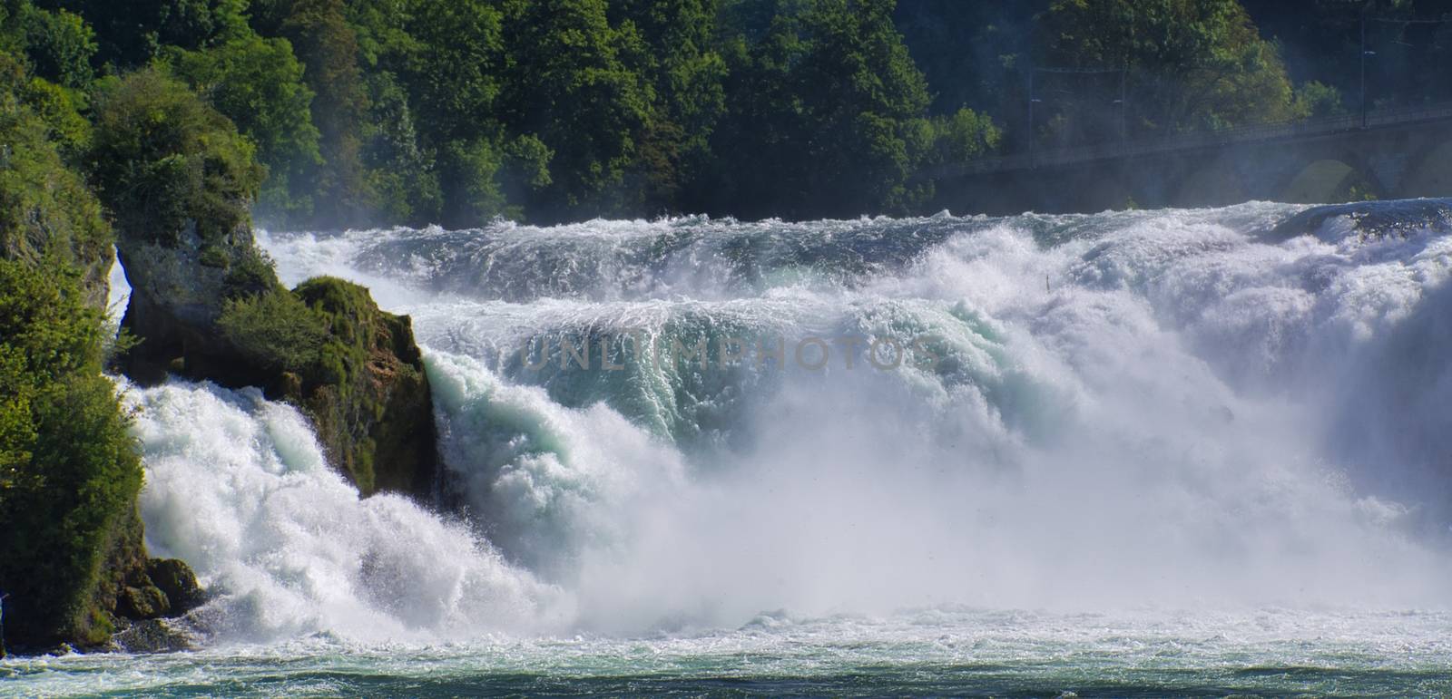 the famous rhine falls in the swiss near the city of Schaffhausen - sunny day and blue sky