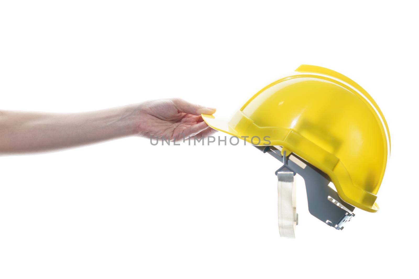 Woman hand holding yellow safety helmet isolated on white background.