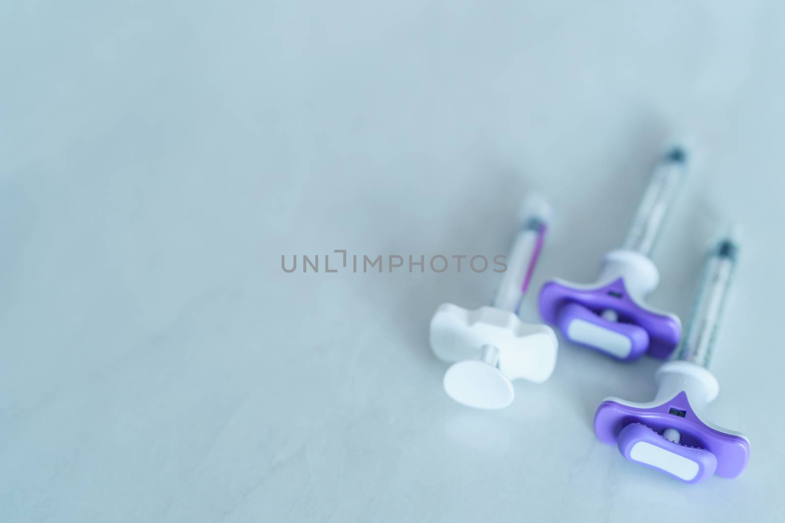 Group of plastic syringe for filler injection on white backgrou by sirawit99