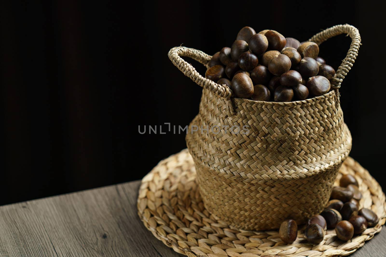 Close-up of wicker basket with full of chestnuts.