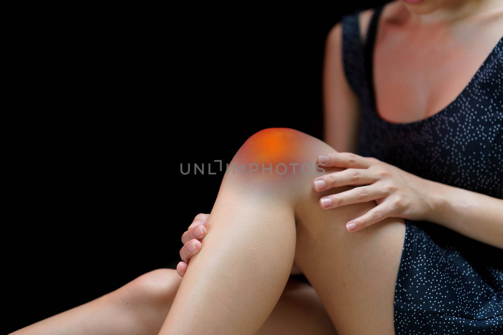 Close up young woman suffering from pain in knee. by sirawit99