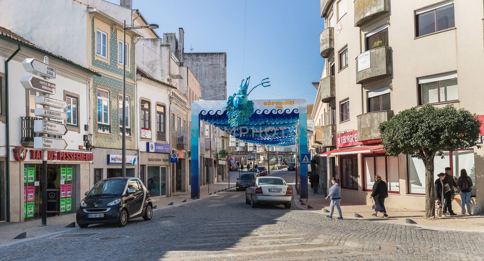Ovar, Portugal - February 18, 2020: architectural detail of the typical houses of the city decorated for the carnival where people are walking on a winter day