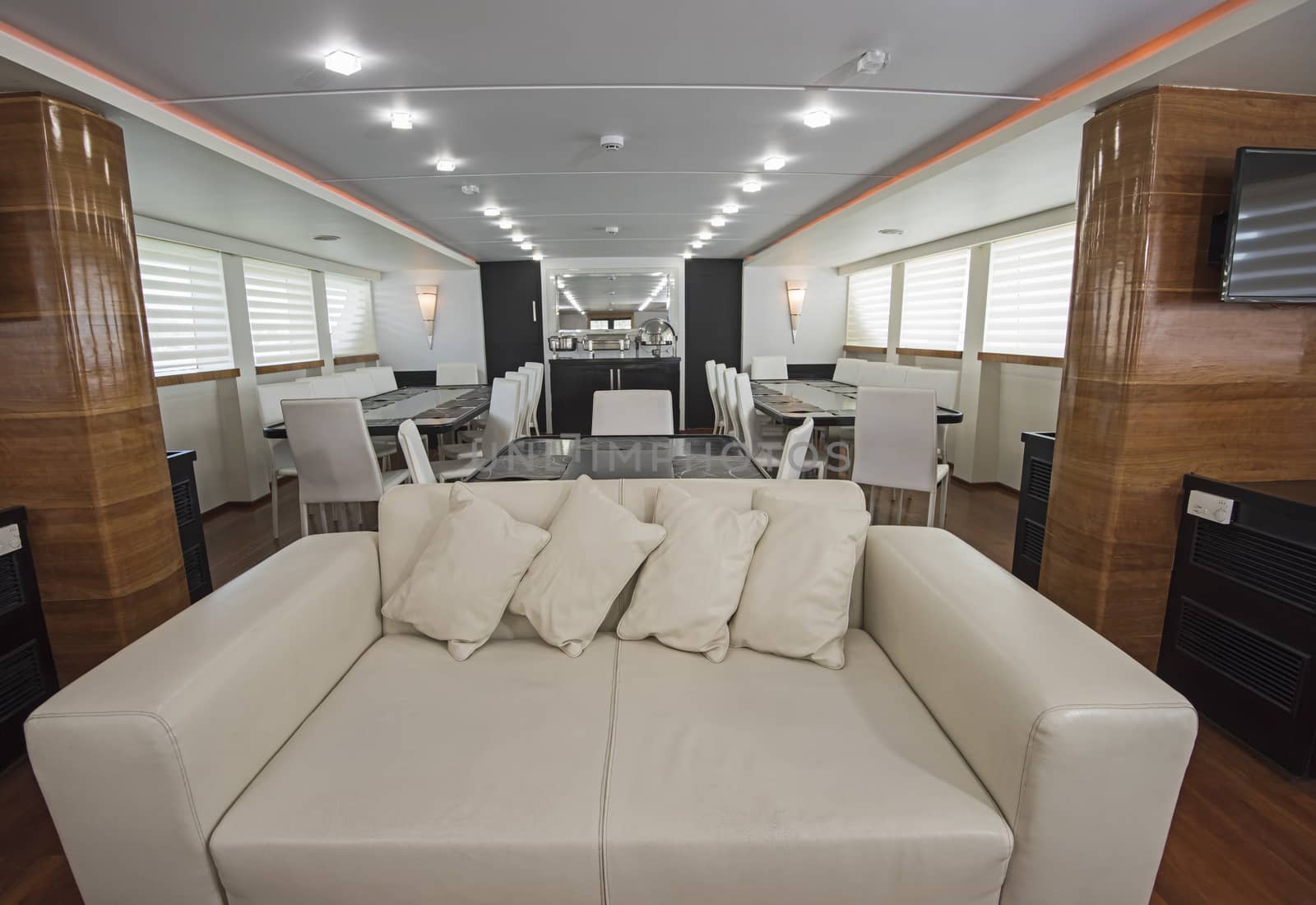 Interior of large salon area of luxury motor yacht by paulvinten