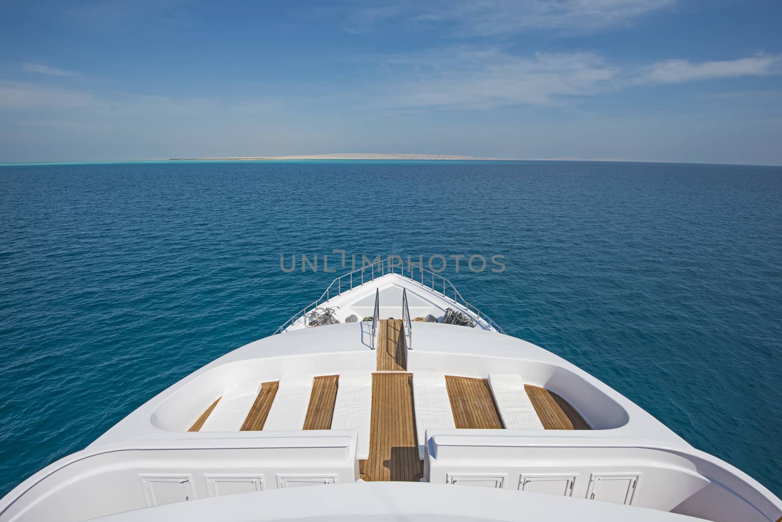 View over the bow over a large luxury motor yacht by paulvinten