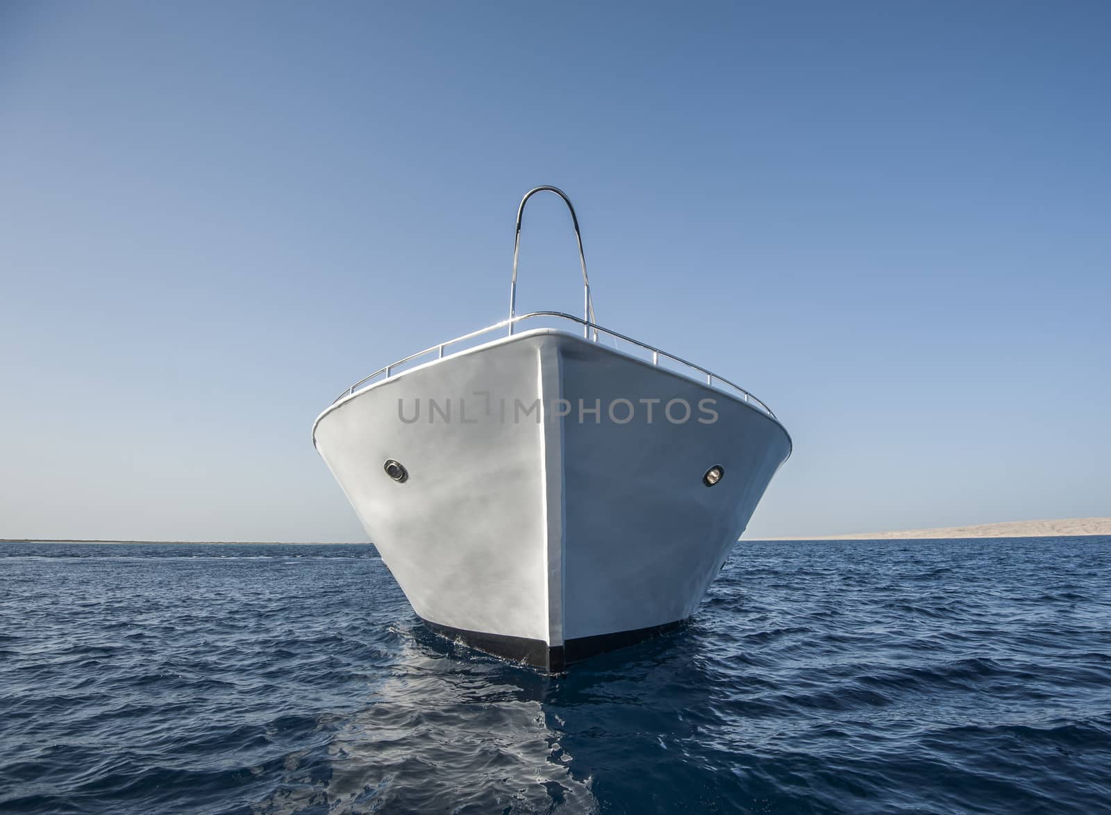 Bow of large motor yacht at sea by paulvinten