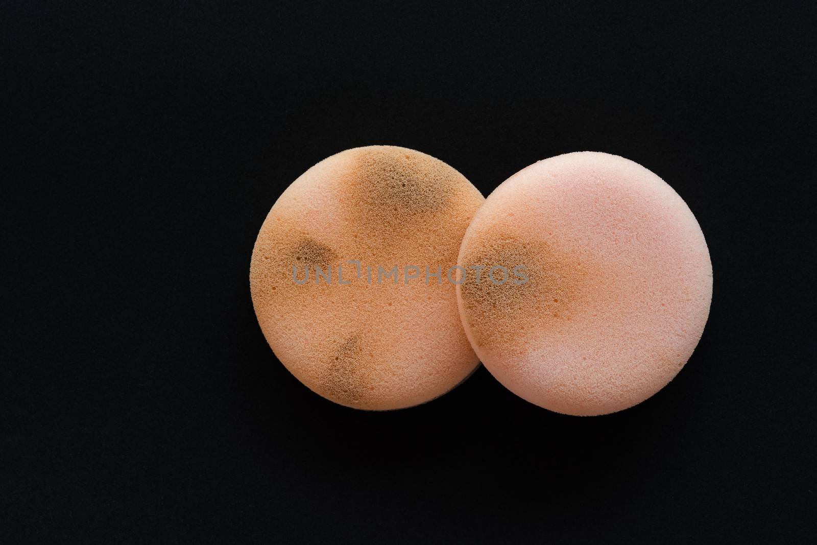 cosmetic sponges on used black background, Clipping path