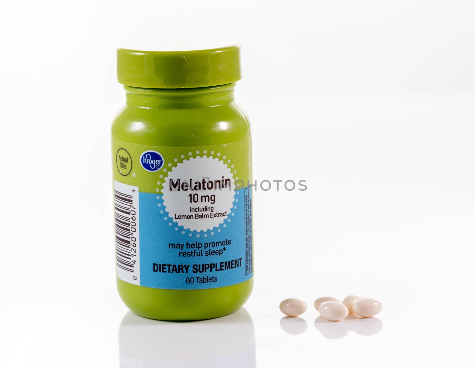 Morgantown, WV - 11 April 2020: Kroger store brand Melatonin capsules and tablet bottle white background