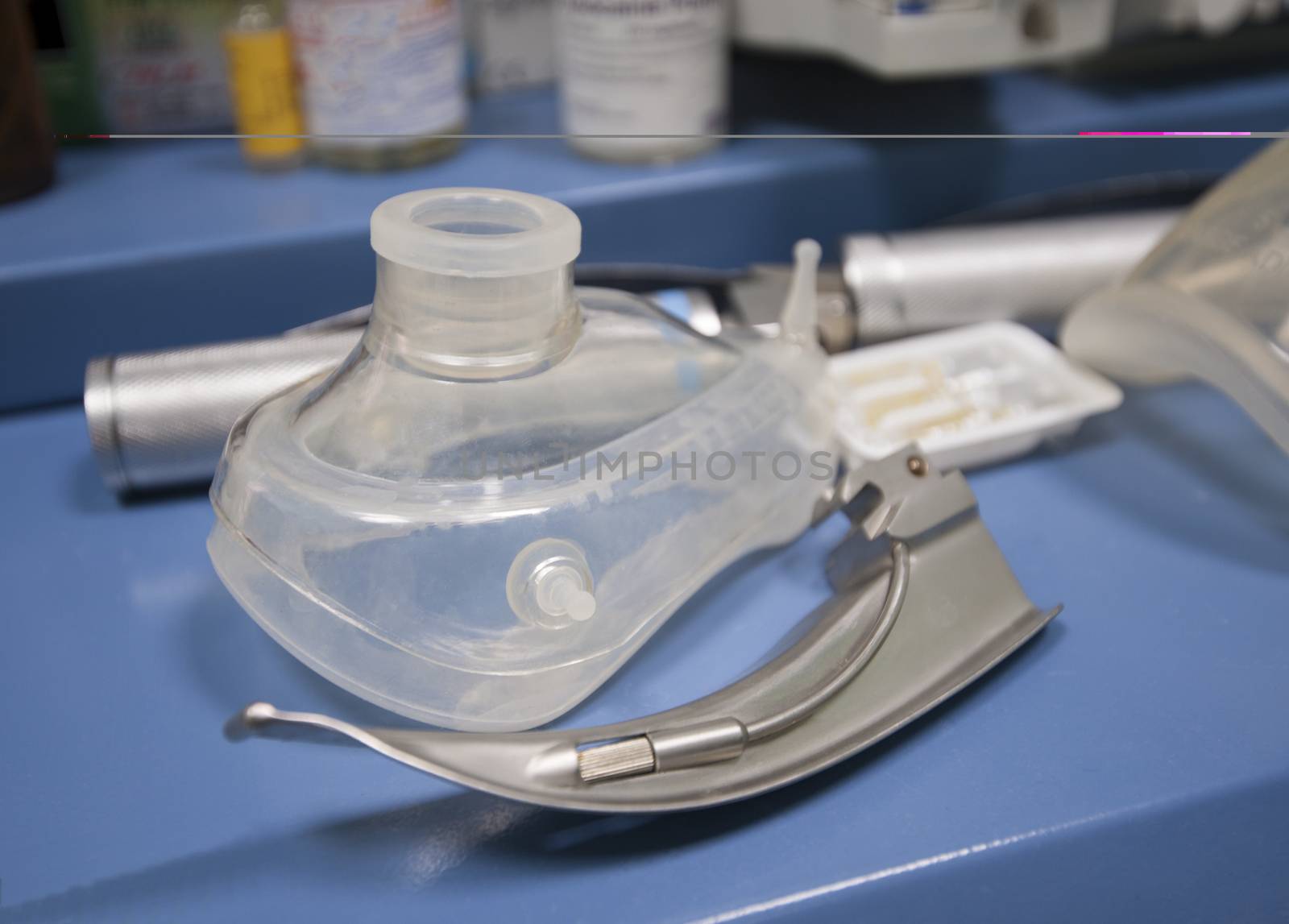 Closeup detail of a plastic oxygen mask on table in operating room
