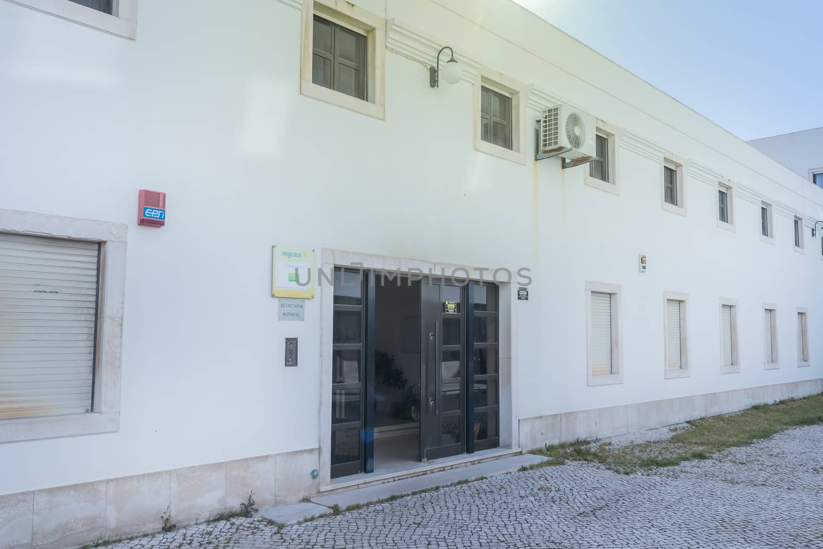 Sesimbra, Portugal - February 19, 2020: Architecture detail of the conservation of civil registers (Conservatoria do Registro Civil) next to the Matriz church of Sesimbra on a winter day