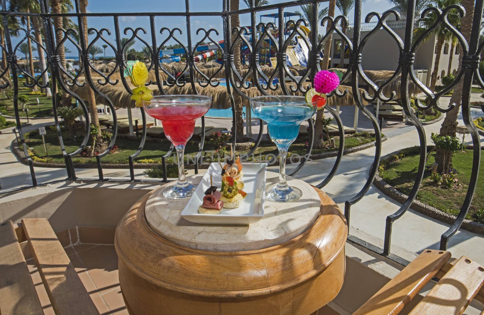 Cocktail drinks on balcony of a luxury hotel room by paulvinten
