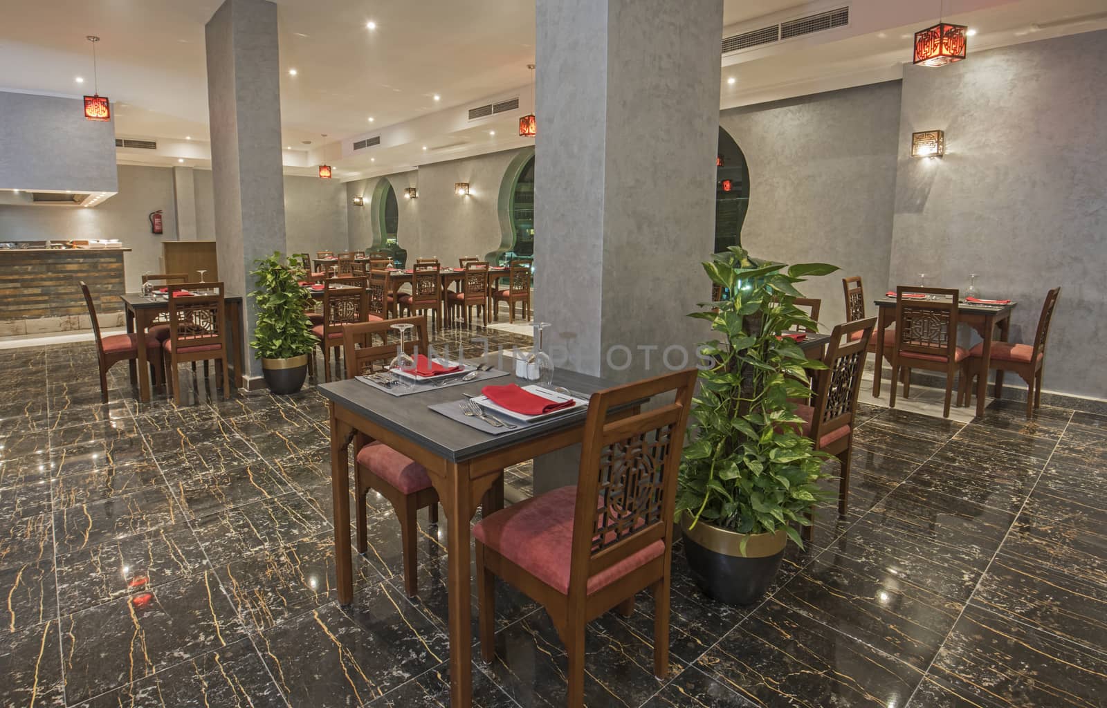 Interior design of a luxury hotel resort Asian restaurant dining area with ornate decor