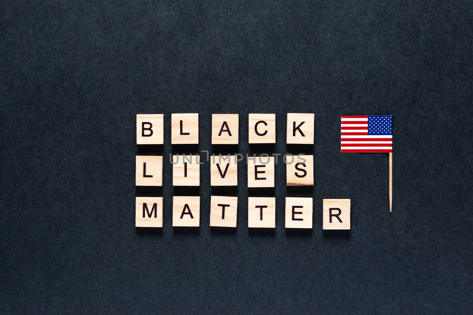 Black lives matter inscription on a black background. unrest. hashtag Blacklivesmatter. protests. American flag. USA