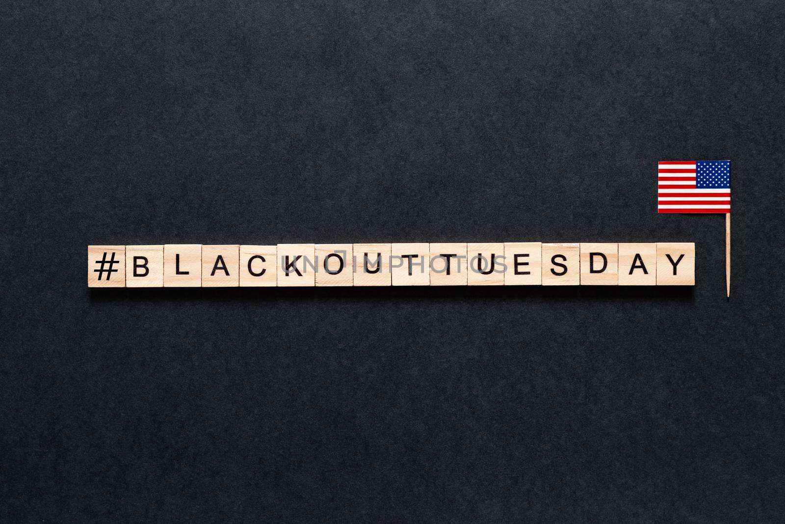 Blackout tuesday inscription on a black background. Black lives matter, blackout tuesday 2020 concept. unrest. rallies. brigandage. marauders. looting. American flag. USA by Pirlik