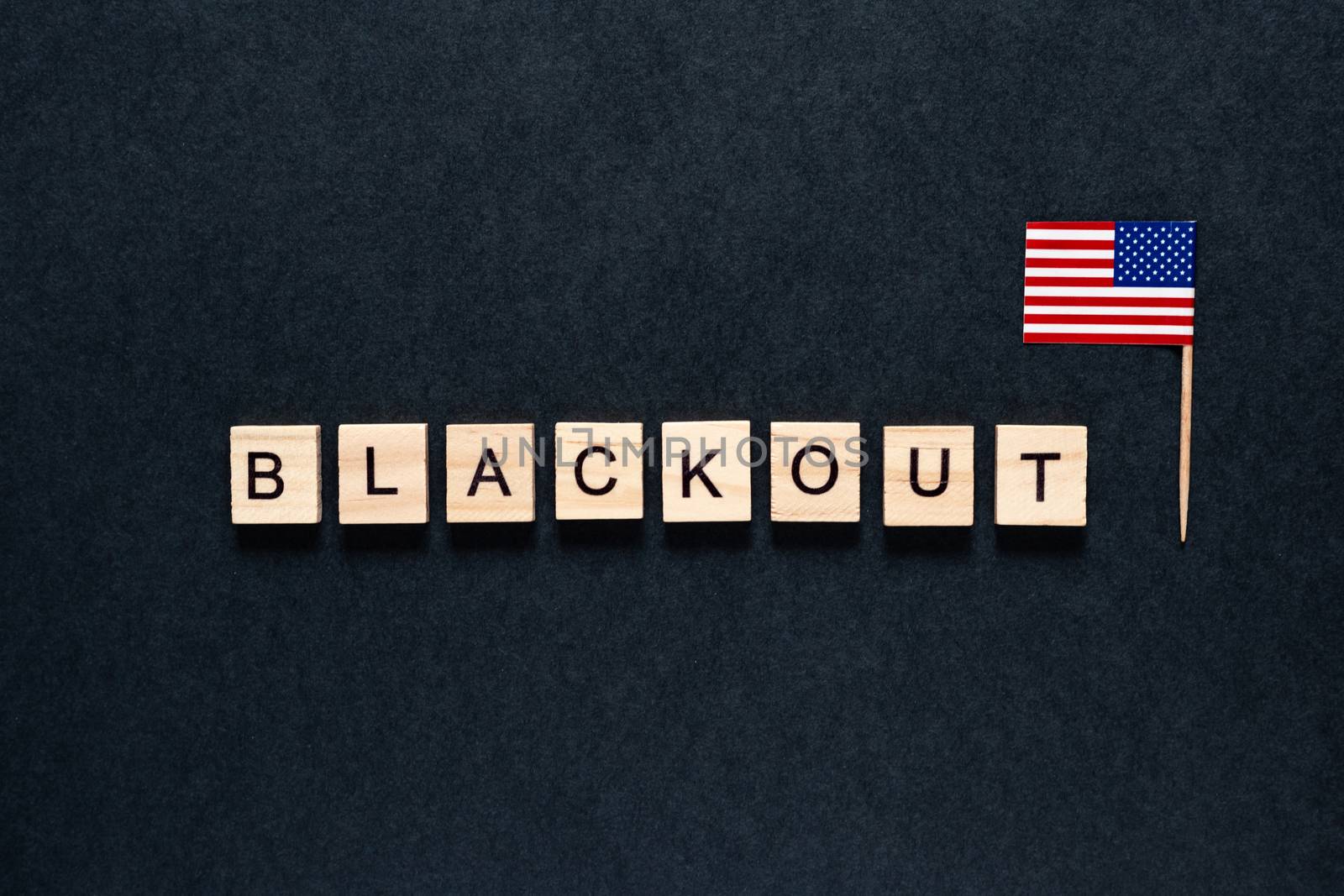 Blackout inscription on a black background. Black lives matter, blackout tuesday 2020 concept. blackout in USA. protests. unrest. American flag.