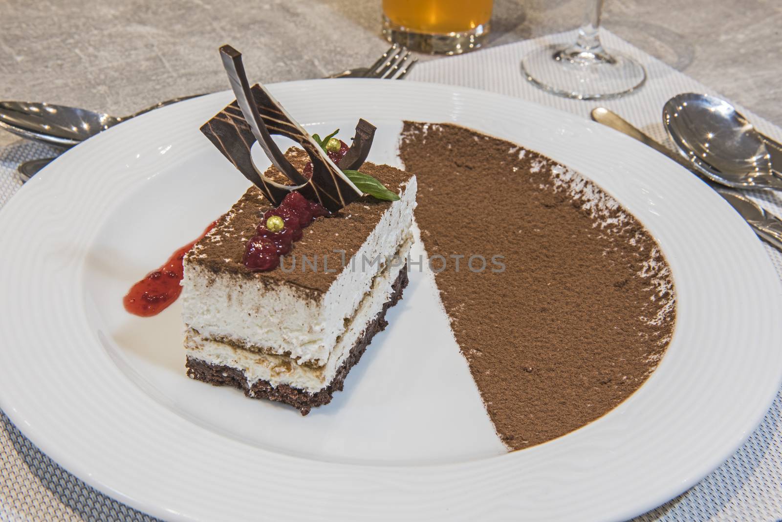 Tiramisu dessert food at luxury a la carte restaurant with cocoa