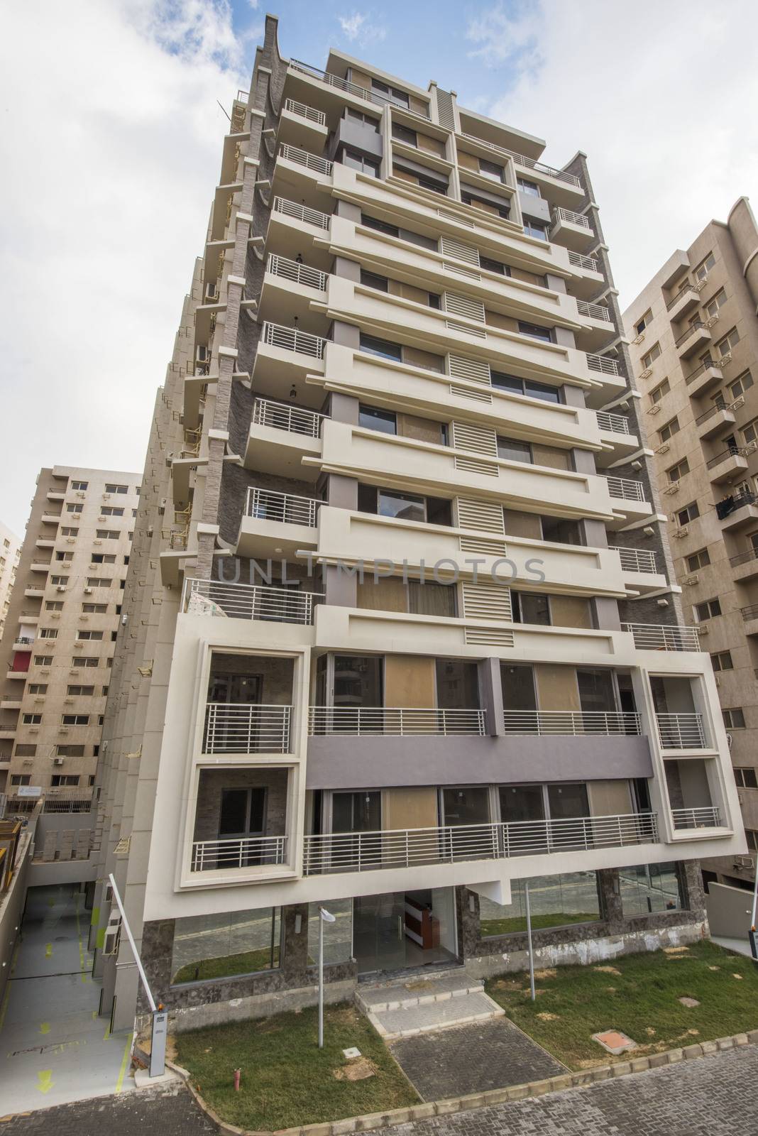 Exterior of a large modern high rise apartment block building