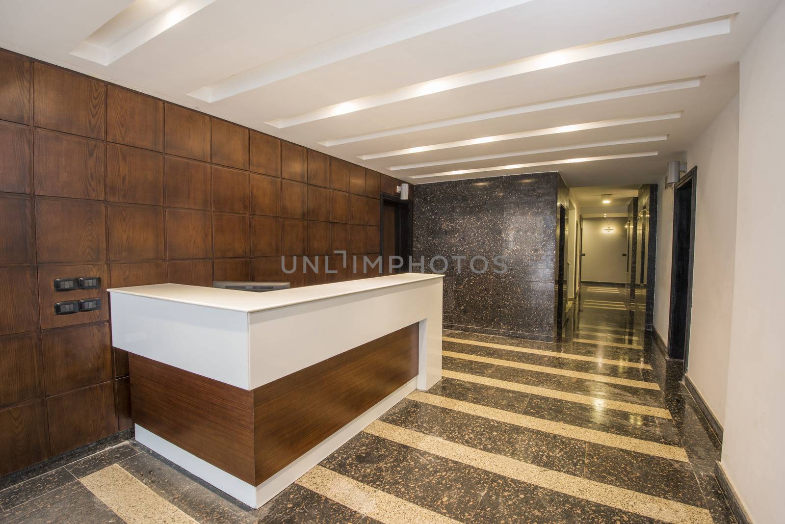 Interior corridor os a luxury apartment building by paulvinten