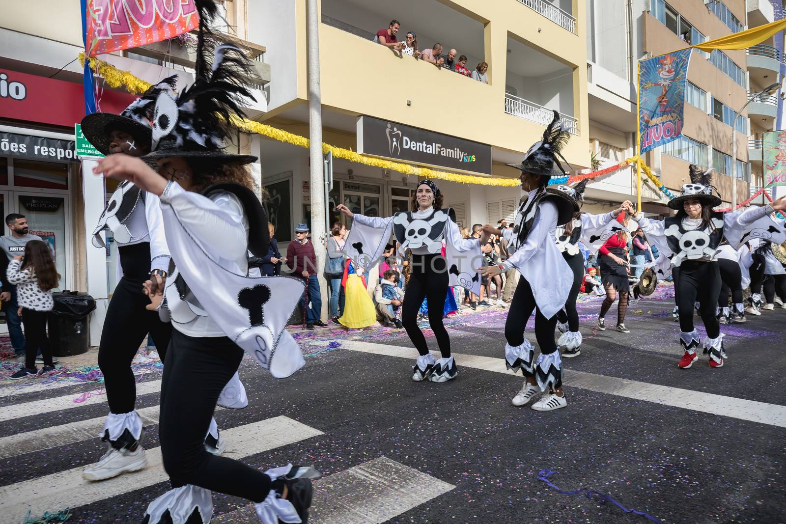 Loule, Portugal - February 25, 2020: dancers parading in the street in front of the public in the parade of the traditional carnival of Loule city on a February day