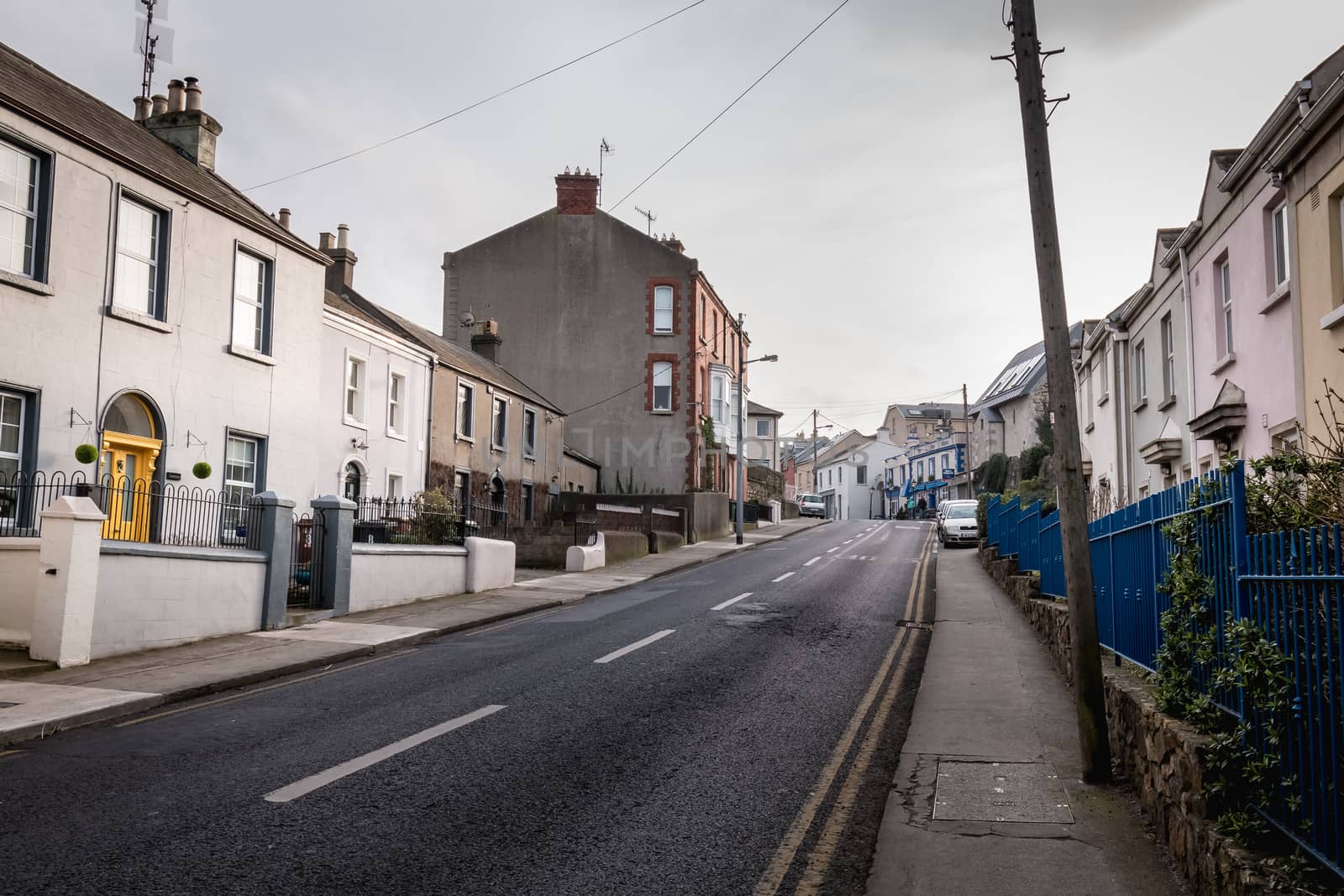 Howth, Ireland - February 15, 2019: Typical architecture of town center houses in a small fishing port near Dublin on a winter day