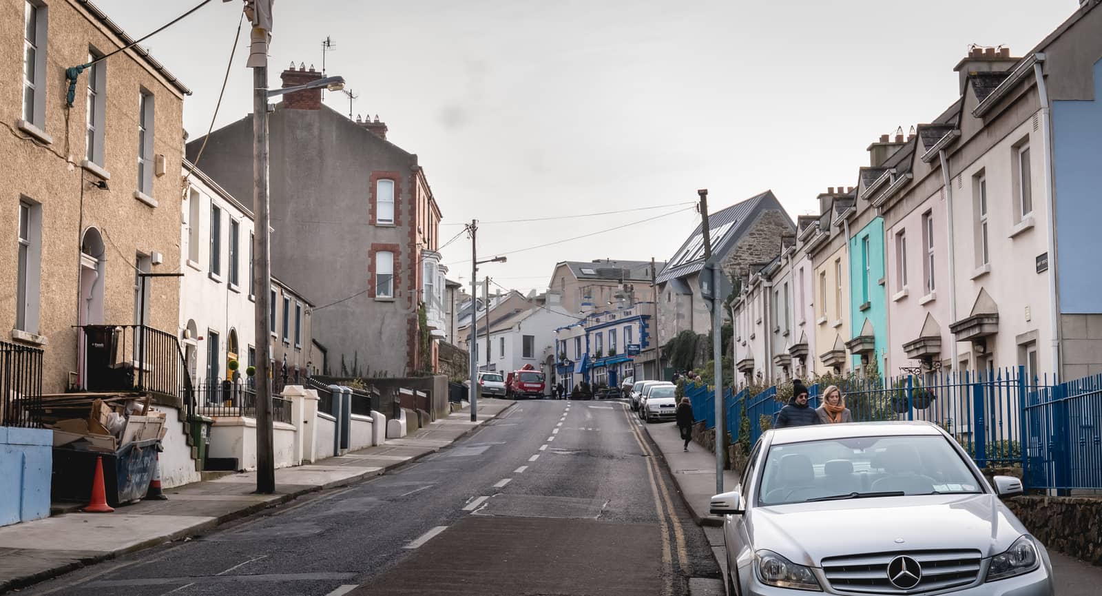 Howth, Ireland - February 15, 2019: Typical architecture of town center houses in a small fishing port near Dublin on a winter day