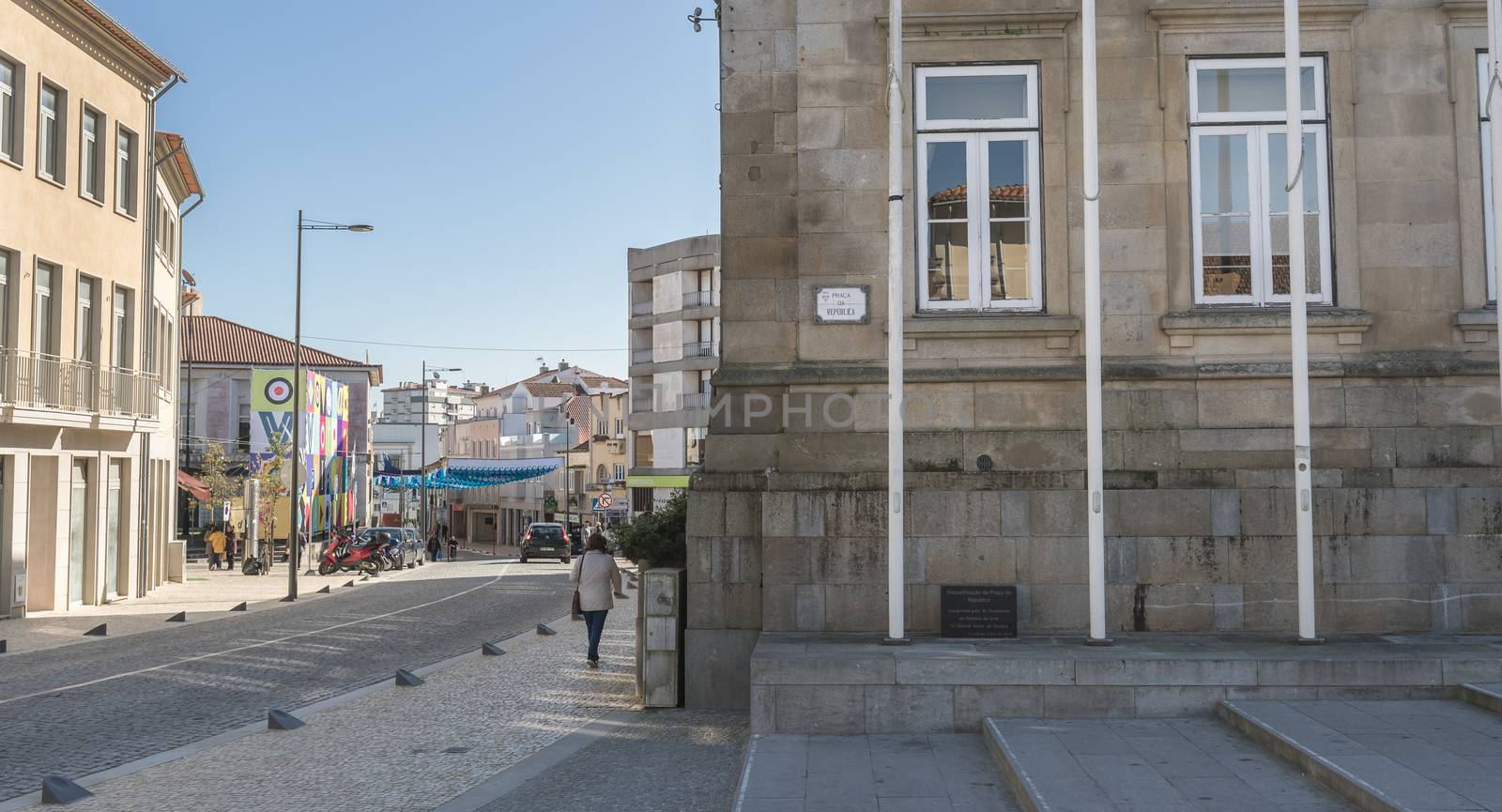 Ovar, Portugal - February 18, 2020: architectural detail of the typical houses of the city decorated for the carnival where people are walking on a winter day