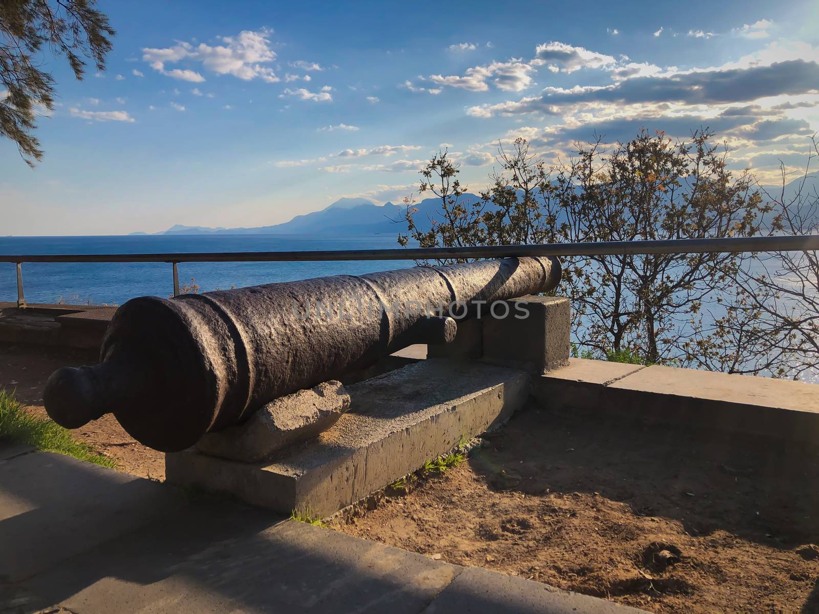 Old Ottoman time cannon with Mediterranean sea mountains and blue sky view