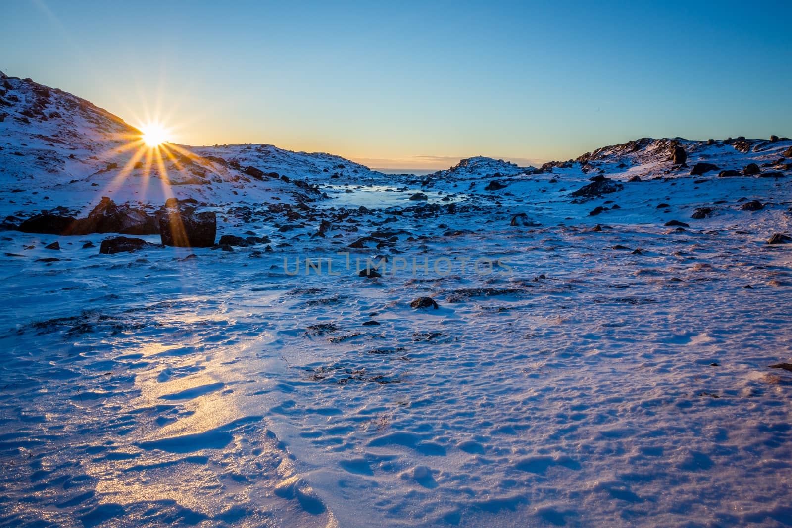 Polar arctic greenlandic sunset over the snow mountains, Nuuk, G by ambeon
