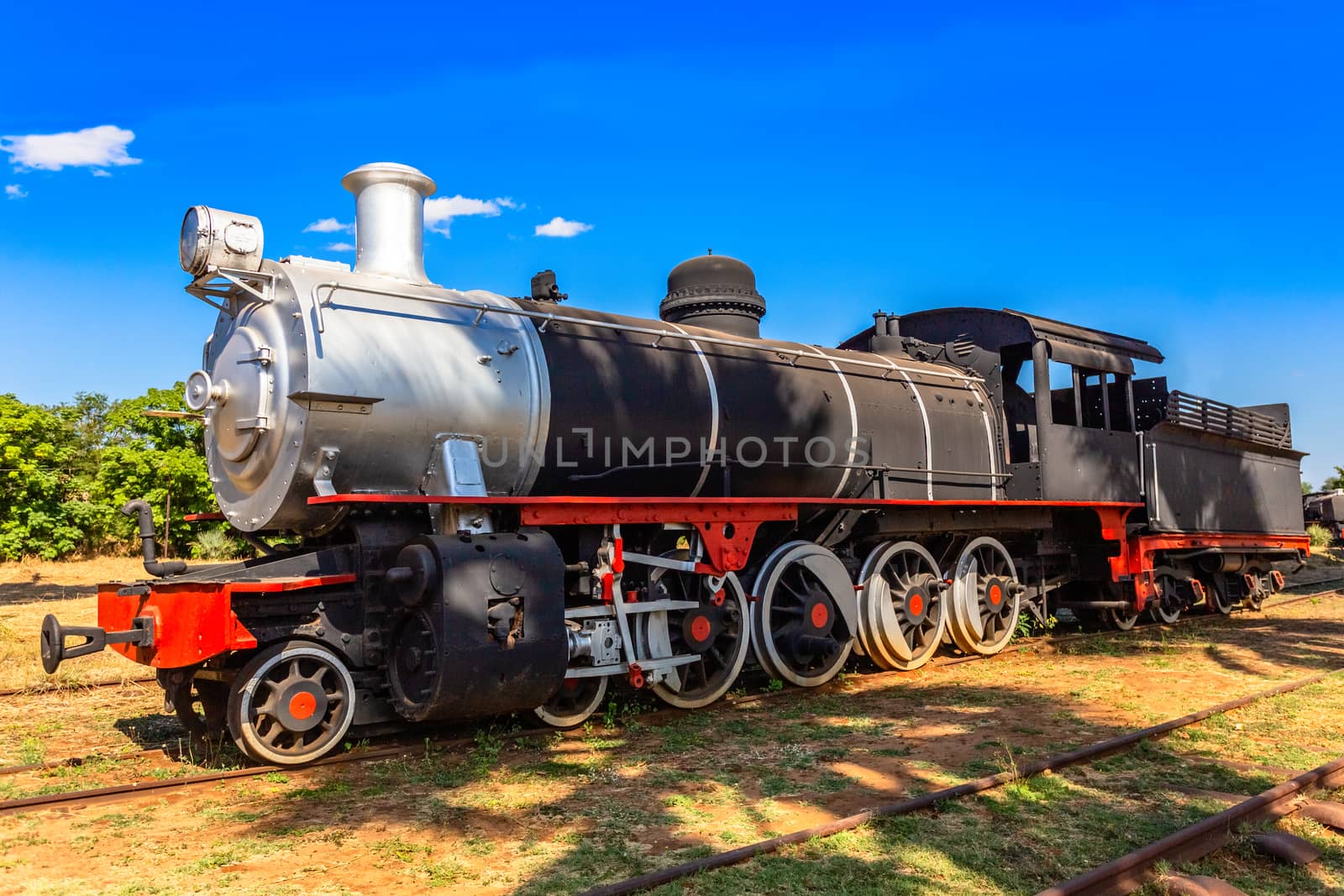 Old retro preserved locomotive train standing on the rails in Livingstone, Zambia