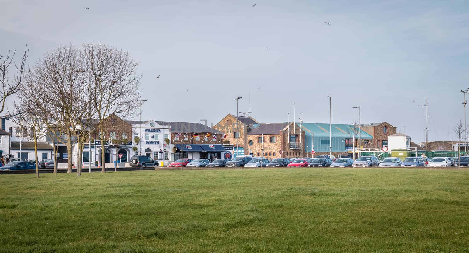 Howth, Ireland - February 15, 2019: Typical architecture of town center houses in a small fishing port near Dublin on a winter day