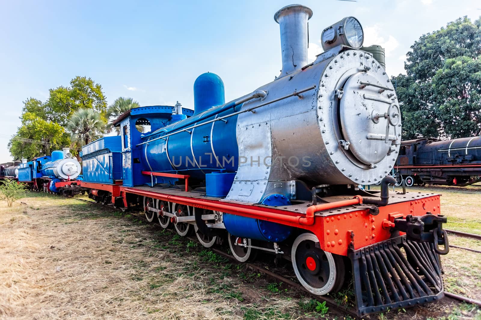 Old retro steel locomotive train standing on the rails in Livingstone, Zambia