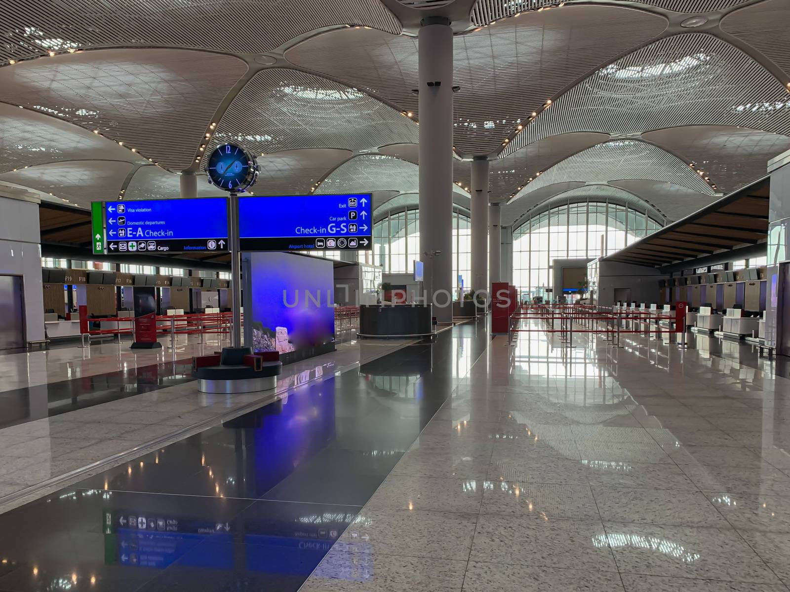 Empty Istanbul airport registration desks and hall no people during covid-19 coronavirus pandemic epidemy in the world quarantine. Horizontal stock photo