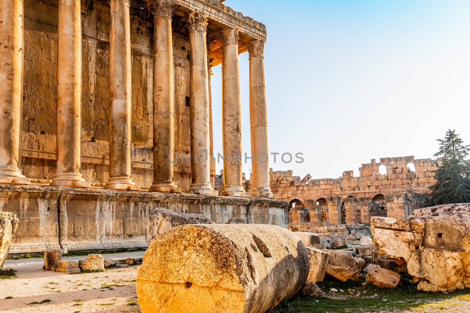 Columns of ancient Roman temple of Bacchus with surrounding ruin by ambeon