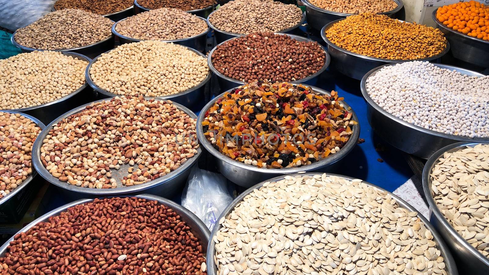 Various nuts and dried fruits in a Turkish bazaar by AlonaGryadovaya