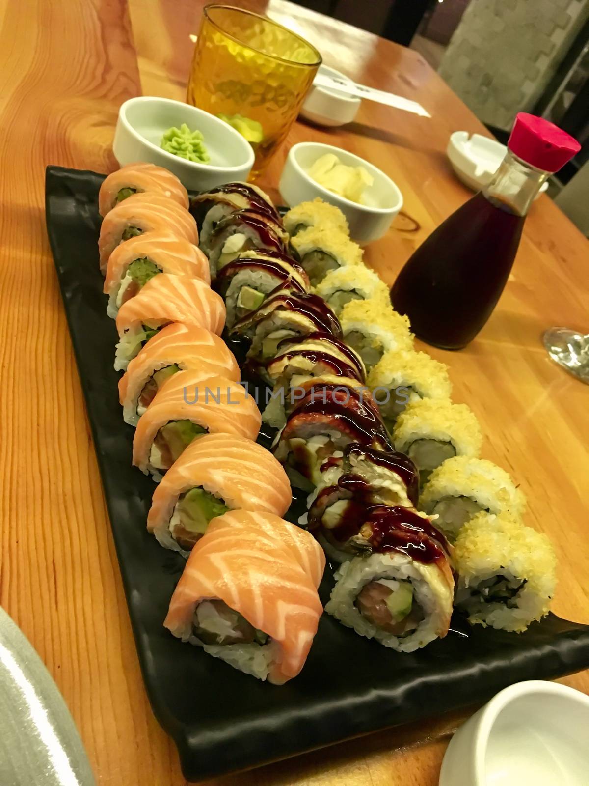 Delicious sushi and rolls on a table in a restaurant