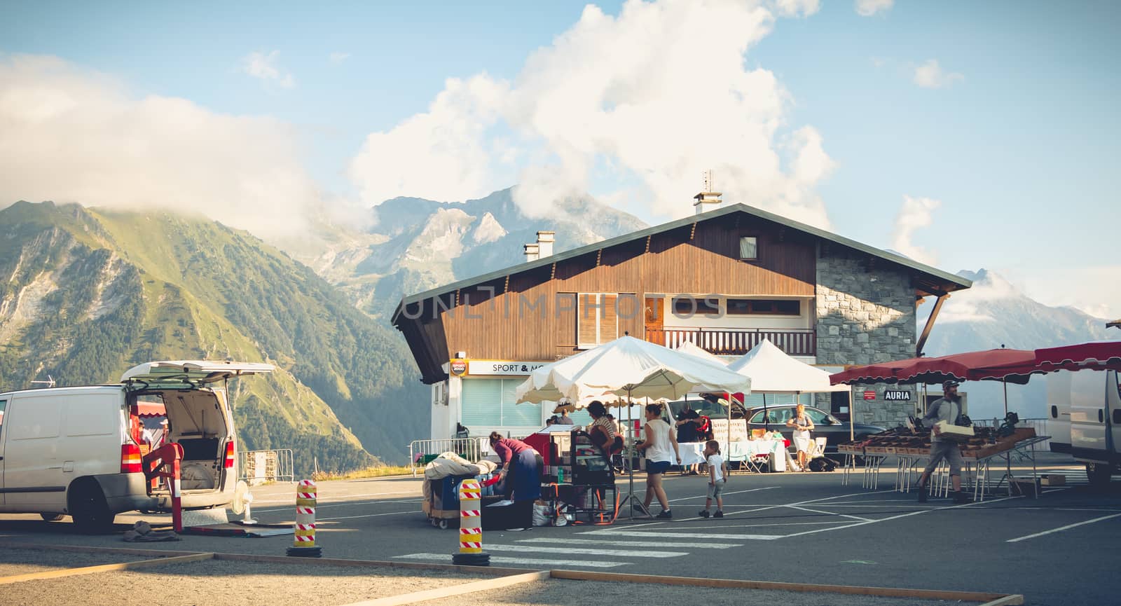 Saint Lary Soulan, France - August 20, 2018: small mountain market in a ski resort in summer where small traders sell sheep cheese to tourists