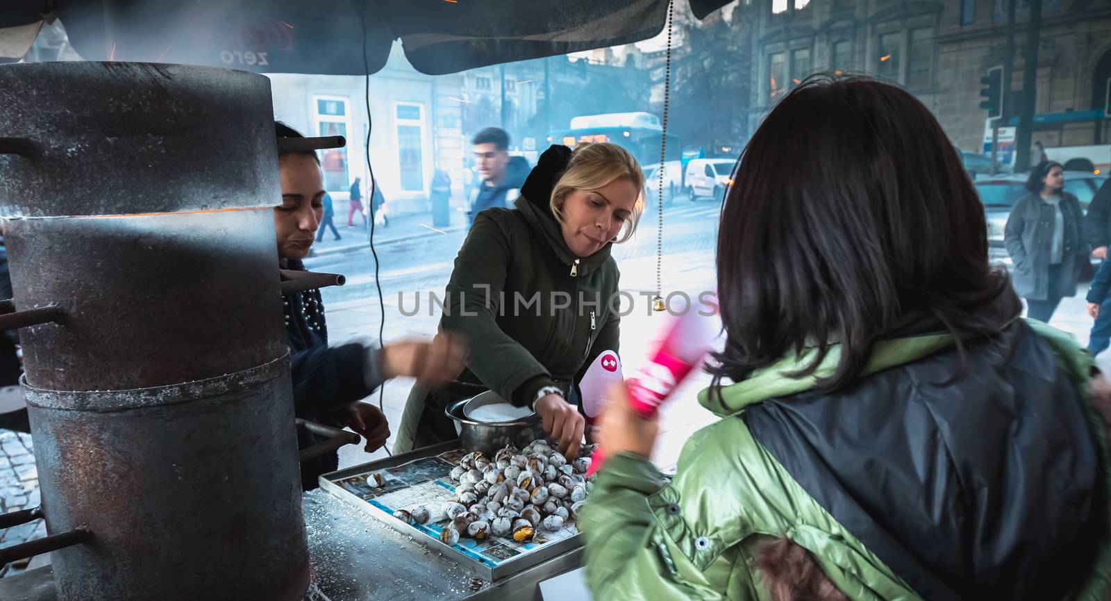 Street vendors of braised chestnuts in front of Sao Bento statio by AtlanticEUROSTOXX