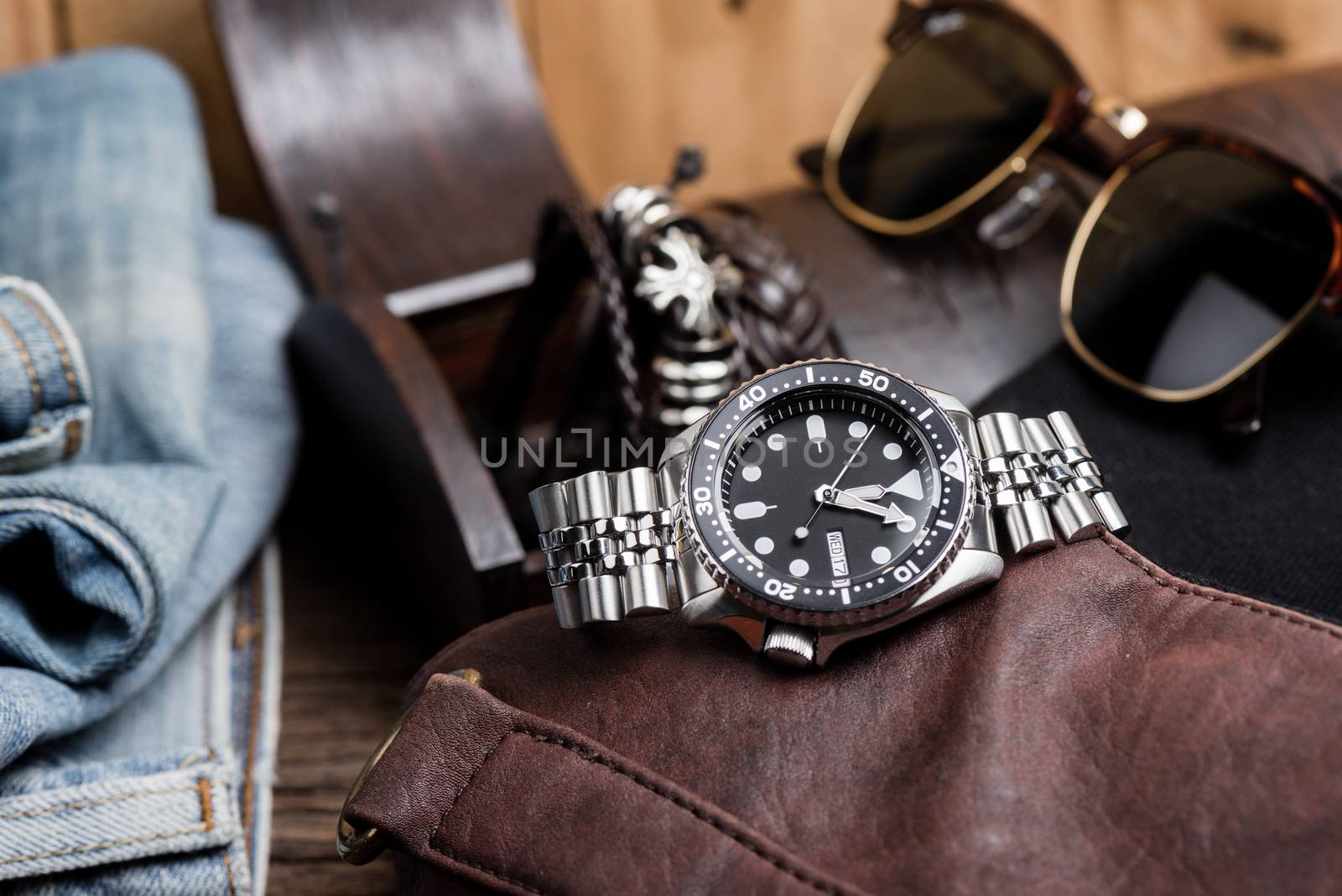 Close up men dive watch with stainless steel bracelet, luxury wristwatch for men.